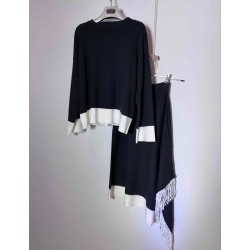 Conjunto punto de jersey y falda con detalle flecos